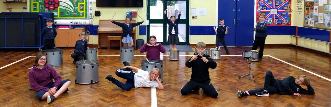 Fun poses from children at drum workshop